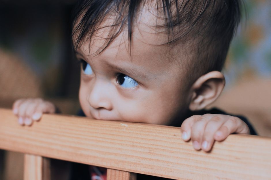 how to stop a baby from biting their lower lip