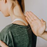 how do spinal nerves exit the vertebral column