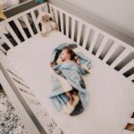how to get your newborn to sleep in a crib