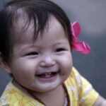 how to tell a baby is teething signs remedies