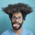 is sticking your tongue out a sign of autism