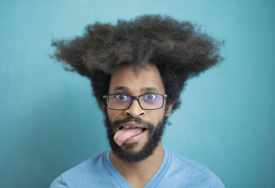 is sticking your tongue out a sign of autism