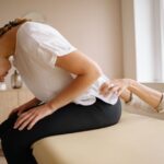 lower back pain cause testicles to ache