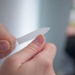 what causes fingernails to flatten out