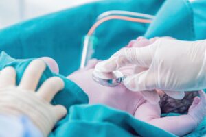what causes necrotizing enterocolitis in newborns