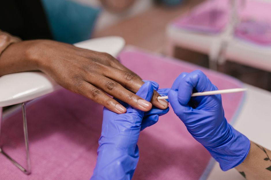 what removes nail glue from skin