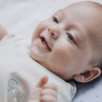when does a newborn laugh