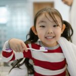 when to brush infant teeth