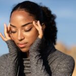 why do i get a headache when i lay down too long