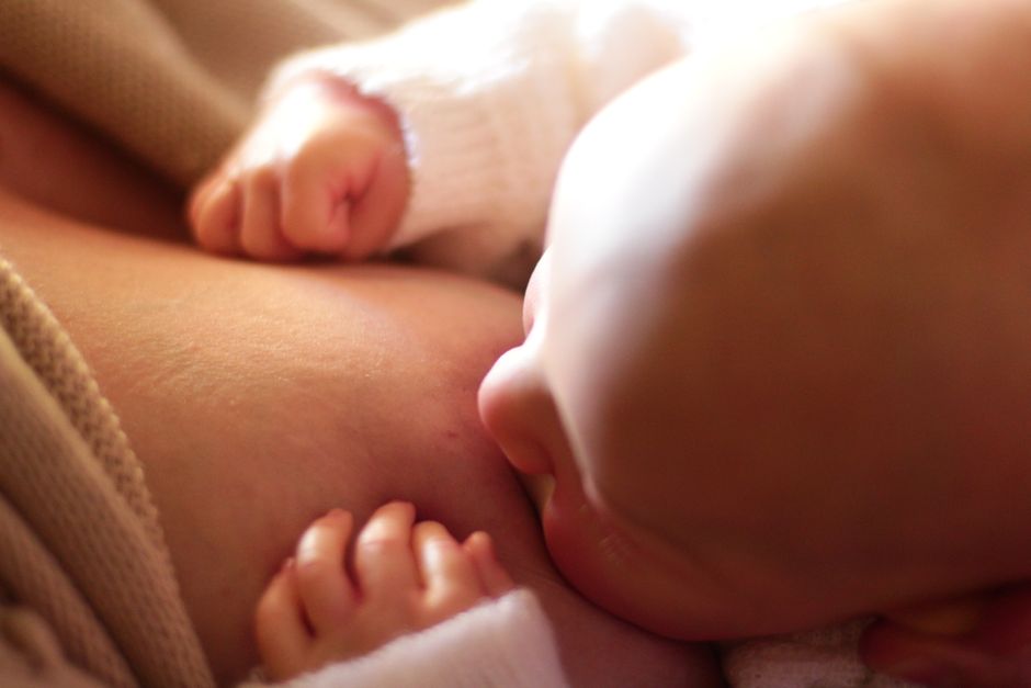 why does my baby cry while breastfeeding how to help