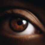 why is my vision darker in one eye