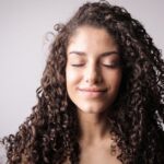 is hair oil good for curly hair benefits and tips