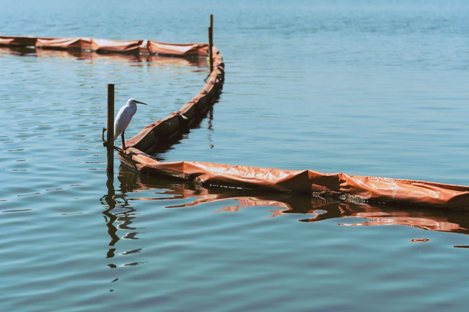 what are booms for oil spills and how do they work