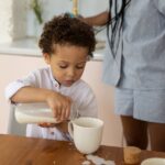 why is my baby spilling milk while bottle feeding