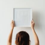 how to safely hang pictures above a crib