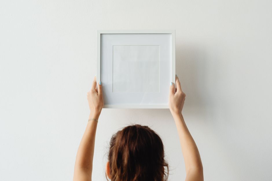 how to safely hang pictures above a crib